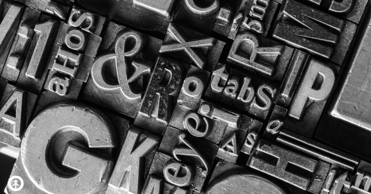 A closeup of metal typesetting blocks. 