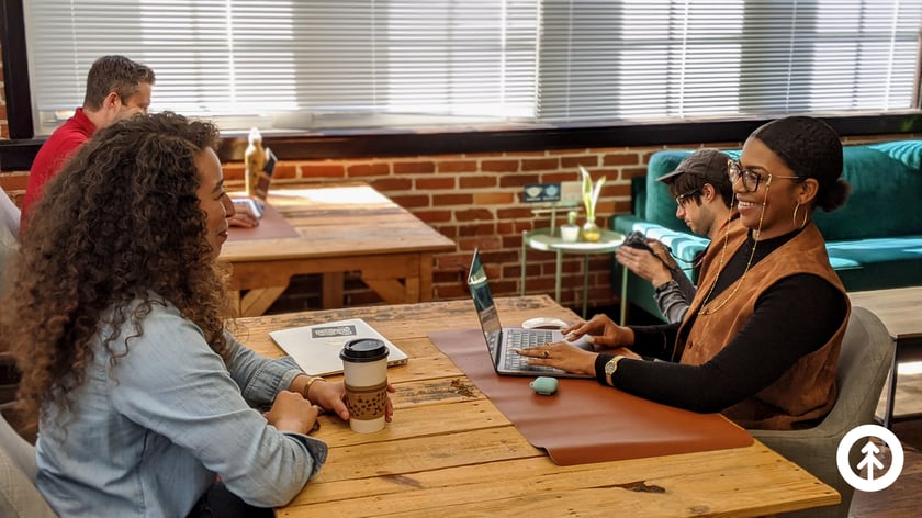 Four Growth team members working in our Headquarters in downtown Orlando, Florida: Will Davidson, Ross Goodman, Katrina Horne, and Ashley Lilly. 