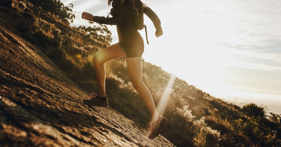 A person running uphill in nature